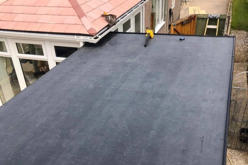 The same flat roof from the same position, finished in single-ply membrane